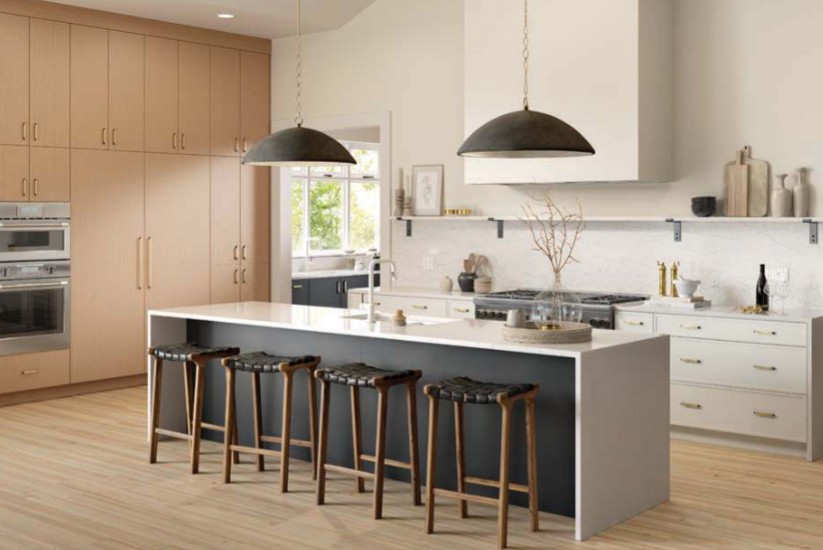 Modern transitional kitchen with white cabinetry and navy island